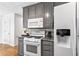 Modern kitchen featuring stainless steel appliances, granite counters, and ample cabinet space at 2077 Alcovy Trace Way, Lawrenceville, GA 30045