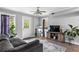 Comfortable living room with a modern gray sofa and stylish decor at 2077 Alcovy Trace Way, Lawrenceville, GA 30045