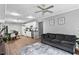 Open-concept living area with a cozy sofa, adjacent to a kitchen and dining space at 2077 Alcovy Trace Way, Lawrenceville, GA 30045