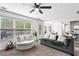 Sun-filled living room with plush seating, neutral tones, and access to outdoor deck at 2077 Alcovy Trace Way, Lawrenceville, GA 30045