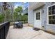 Cozy back patio with outdoor dining and serene backyard views at 2077 Alcovy Trace Way, Lawrenceville, GA 30045