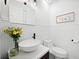 Chic powder room featuring white wainscoting, a vessel sink, and modern fixtures offers a stylish design at 4009 Glenlake Nw Trce, Kennesaw, GA 30144