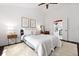 Bedroom with wood floors, ensuite access to a luxurious bathroom, and neutral decor for a calm feel at 4009 Glenlake Nw Trce, Kennesaw, GA 30144