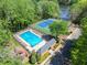 Aerial shot of a sparkling community pool with ample lounge space and beautiful landscaping at 4009 Glenlake Nw Trce, Kennesaw, GA 30144