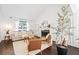 Inviting living room boasts a fireplace, hardwood floors, and neutral decor for a comfortable atmosphere at 4009 Glenlake Nw Trce, Kennesaw, GA 30144