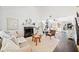 Bright living room with a fireplace, hardwood floors, and neutral decor offers a cozy and inviting space at 4009 Glenlake Nw Trce, Kennesaw, GA 30144