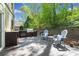 Enjoy the outdoor kitchen with a built in grill and seating area on the rear deck at 4009 Glenlake Nw Trce, Kennesaw, GA 30144