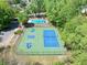 Aerial view featuring tennis and basketball courts next to a pool, perfect for active community living at 4009 Glenlake Nw Trce, Kennesaw, GA 30144