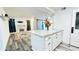 Modern kitchen island with granite countertop overlooks spacious living area and fireplace at 1382 Branch Dr, Tucker, GA 30084