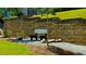 A peaceful outdoor bench surrounded by mature trees and greenery at 1382 Branch Dr, Tucker, GA 30084