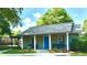 Charming community clubhouse features a well-maintained exterior and inviting entrance with benches and landscaping at 1382 Branch Dr, Tucker, GA 30084