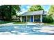 Attractive community clubhouse featuring designated visitor parking spaces and well-kept landscaping at 1382 Branch Dr, Tucker, GA 30084