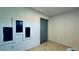 Bright entryway featuring unique architectural wall cutouts, tile flooring, and a modern gray sliding barn door at 1382 Branch Dr, Tucker, GA 30084