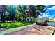 Well-maintained community area with lush greenery, a flag, and a charming building at 1382 Branch Dr, Tucker, GA 30084