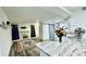 Open concept living room with wood floors, fireplace and kitchen island at 1382 Branch Dr, Tucker, GA 30084