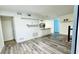 Bright open floor plan featuring wood floors, an open doorway and white walls at 1382 Branch Dr, Tucker, GA 30084