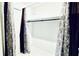 Walk-in closet with curtains and rod for hanging clothes at 1382 Branch Dr, Tucker, GA 30084