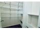 Spacious walk-in closet with shelving and dark carpet floor at 1382 Branch Dr, Tucker, GA 30084
