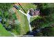 Aerial view of a home with long driveway, surrounded by lush greenery at 3405 River Ridge, Stockbridge, GA 30281