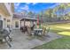 Back patio with a gazebo, table, and chairs at 3405 River Ridge, Stockbridge, GA 30281