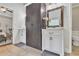 Bathroom features dual vanities, a large cabinet, and travertine floors at 3405 River Ridge, Stockbridge, GA 30281