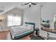 Bright bedroom with vaulted ceiling, ceiling fan, and ample natural light with a queen-size bed at 3405 River Ridge, Stockbridge, GA 30281