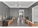 Stylish dining room with wood floors, wainscotting, and modern light fixture at 3405 River Ridge, Stockbridge, GA 30281