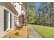 Exterior detail of a two story white brick home and garden at 3405 River Ridge, Stockbridge, GA 30281