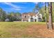 Charming two-story white brick home with manicured lawn and lovely landscaping at 3405 River Ridge, Stockbridge, GA 30281