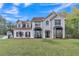 Charming two-story white brick home with manicured lawn and lovely landscaping at 3405 River Ridge, Stockbridge, GA 30281