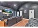 Enjoy this home theater with black walls, reclining chairs, and a large screen for movie nights at 3405 River Ridge, Stockbridge, GA 30281