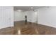 Spacious living area with hardwood floors, access to the kitchen, and plenty of natural light at 1150 Collier Nw Rd # F11, Atlanta, GA 30318