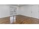 Living area featuring hardwood floors, double doors to the outside, and a separate door at 1150 Collier Nw Rd # F11, Atlanta, GA 30318