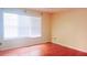 Bedroom featuring a large window, laminate floors and neutral paint at 4443 Whitt Mill Nw Rd, Acworth, GA 30101
