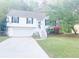 Charming two-story home with a well-manicured lawn and an inviting front entrance at 4443 Whitt Mill Nw Rd, Acworth, GA 30101