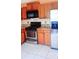 Kitchen features stainless steel appliances, granite countertops and white tile flooring at 4443 Whitt Mill Nw Rd, Acworth, GA 30101