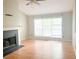 Spacious living room featuring a fireplace, large windows and laminate floors at 4443 Whitt Mill Nw Rd, Acworth, GA 30101