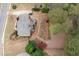Aerial view showcasing the backyard with a large deck and patio area, surrounded by mature trees and landscaping at 111 Glen Trl, Woodstock, GA 30188
