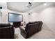 Home theater in basement with comfortable leather seating and projector at 111 Glen Trl, Woodstock, GA 30188
