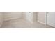 Carpeted basement corner with beige walls, and neutral flooring with two doors at 111 Glen Trl, Woodstock, GA 30188