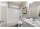 Bright bathroom with white tile, large mirror, and modern vanity at 111 Glen Trl, Woodstock, GA 30188