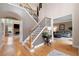 Bright foyer with hardwood floors, staircase with iron spindles, and soaring ceilings at 111 Glen Trl, Woodstock, GA 30188