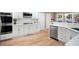 Modern kitchen with white cabinets, stainless steel appliances, and plenty of counter space at 111 Glen Trl, Woodstock, GA 30188