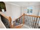 Elegant staircase with wooden banister, black wrought iron spindles, and lots of light at 111 Glen Trl, Woodstock, GA 30188