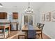 Bright dining area with modern light fixture and access to outdoor patio at 1736 Brookside Lay Cir, Norcross, GA 30093