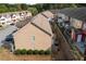 Aerial view of a home exterior with a small yard and fence at 1736 Brookside Lay Cir, Norcross, GA 30093