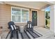 Cozy front porch with seating and a decorative wreath that enhance the home's curb appeal at 1736 Brookside Lay Cir, Norcross, GA 30093