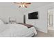 Main bedroom boasts a ceiling fan and modern media setup at 1736 Brookside Lay Cir, Norcross, GA 30093
