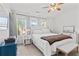Bright main bedroom boasts vaulted ceiling, ceiling fan, and three bright windows at 1736 Brookside Lay Cir, Norcross, GA 30093