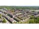 Aerial view of a residential community surrounded by trees and city skyline in the distance at 2251 W Village Se Ln, Smyrna, GA 30080